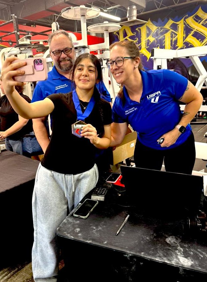 Fatima smiling with her medal after the competition